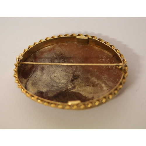 668 - An oval carved shell cameo depicting two nymphs by a lake, in hallmarked 9ct gold frame, 6cms approx