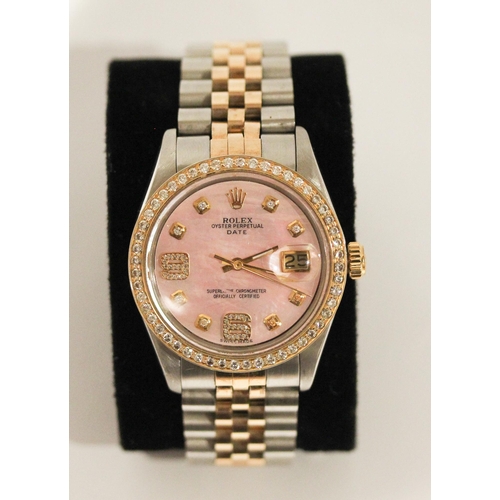 669 - A Rolex Oyster perpetual date wristwatch with retro fit diamond bezel, diamond numerals and pink mot... 