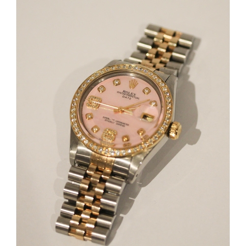 669 - A Rolex Oyster perpetual date wristwatch with retro fit diamond bezel, diamond numerals and pink mot... 