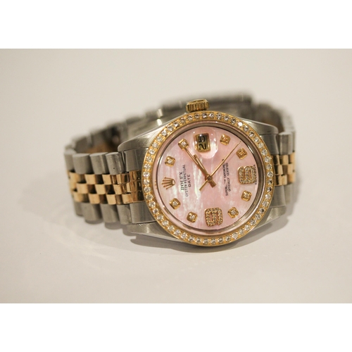 669 - A Rolex Oyster perpetual date wristwatch with retro fit diamond bezel, diamond numerals and pink mot... 