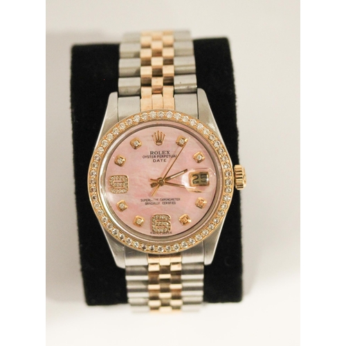 669 - A Rolex Oyster perpetual date wristwatch with retro fit diamond bezel, diamond numerals and pink mot... 