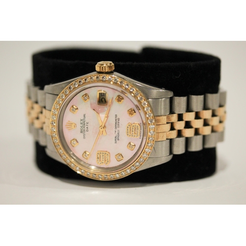 669 - A Rolex Oyster perpetual date wristwatch with retro fit diamond bezel, diamond numerals and pink mot... 