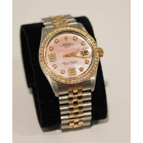 669 - A Rolex Oyster perpetual date wristwatch with retro fit diamond bezel, diamond numerals and pink mot... 