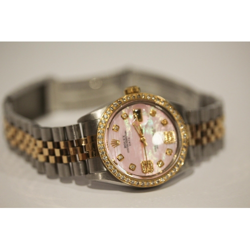 669 - A Rolex Oyster perpetual date wristwatch with retro fit diamond bezel, diamond numerals and pink mot... 