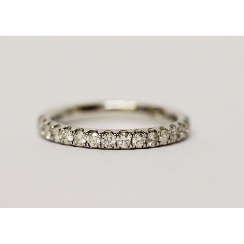 686 - A modern 9ct white gold diamond set half hoop eternity ring, ring size P