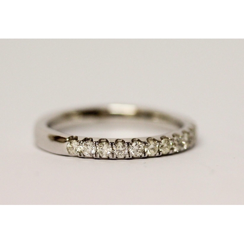 686 - A modern 9ct white gold diamond set half hoop eternity ring, ring size P