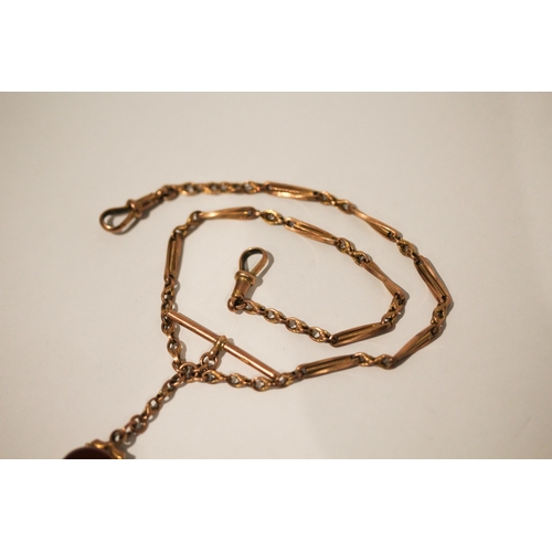 687 - 9ct rose gold fancy link Albert chain with T-bar and hard stone fob, gross weight 13.8gms