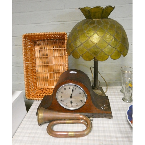 348 - A chiming mantle clock, brass table lamp, copper bugle and a basket