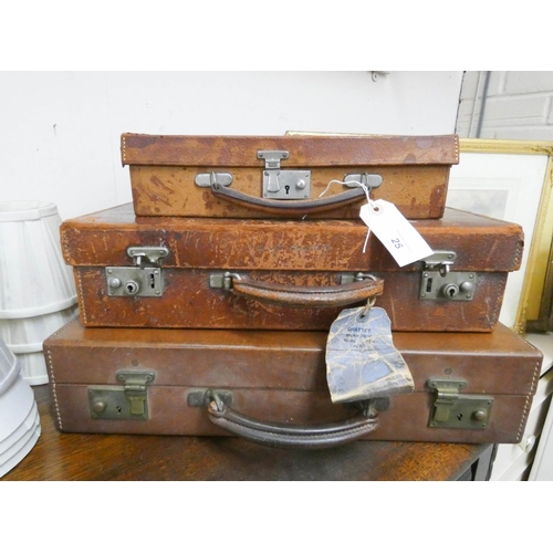 25 - Stack of vintage leather luggage