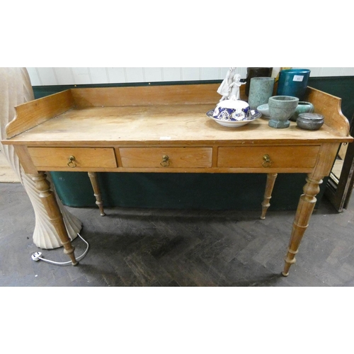 92 - Late Victorian stripped pine tray topped writing table or dressing table fitted three drawers.