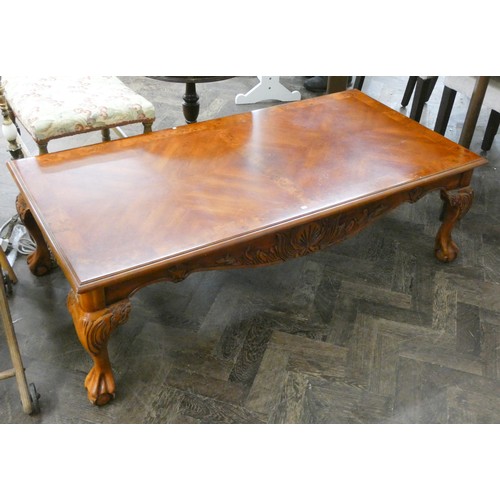 54 - Large burr walnut veneer rectangular coffee table with carved apron and claw and ball feet