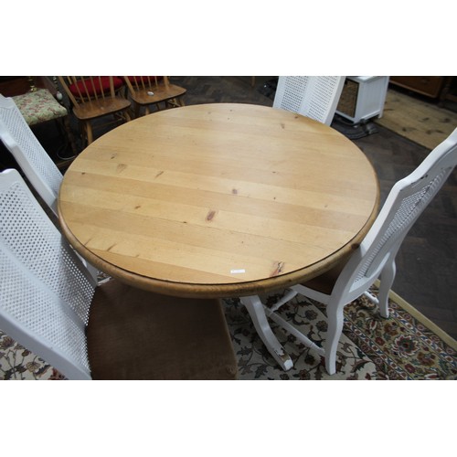 79 - Circular farmhouse style pine kitchen table on white painted base and four white painted cane panel ... 