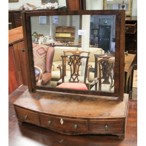 469 - A Georgian mahogany swing toilet mirror on bow front base fitted three drawers