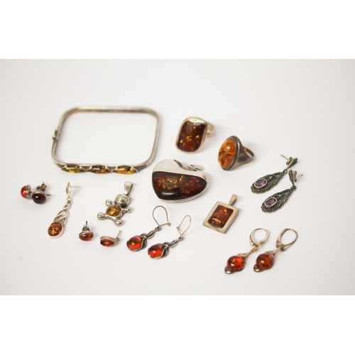 698 - A collection of silver and amber jewellery to include a bangle