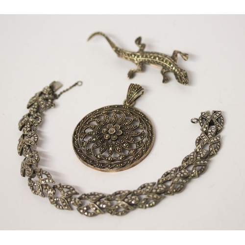 699 - Vintage and marcasite bracelet, lizard brooch and a circular pendant