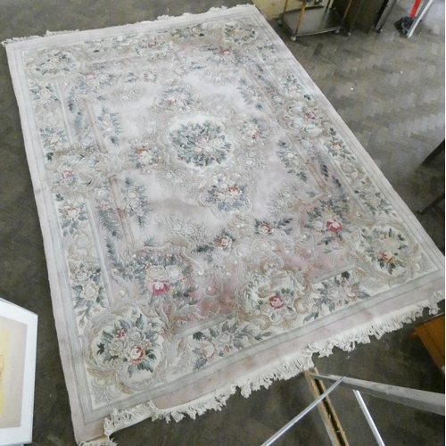 143 - A large cream and floral embossed Chinese carpet, 12' x 9'3 approximately