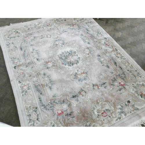 143 - A large cream and floral embossed Chinese carpet, 12' x 9'3 approximately