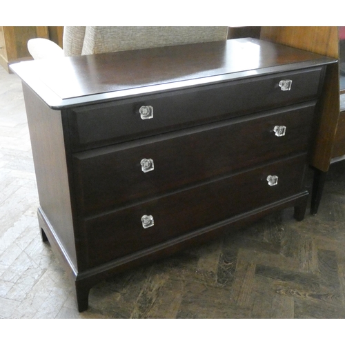 128 - A low Stag Minstrel mahogany chest of three long drawers, 3'6 wide