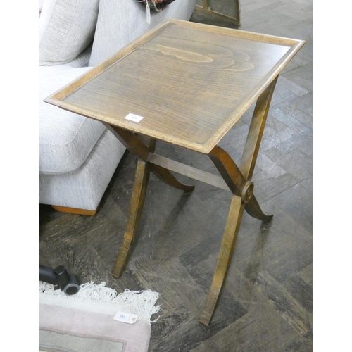 130 - An occasional table with tray top on a cross stretcher base