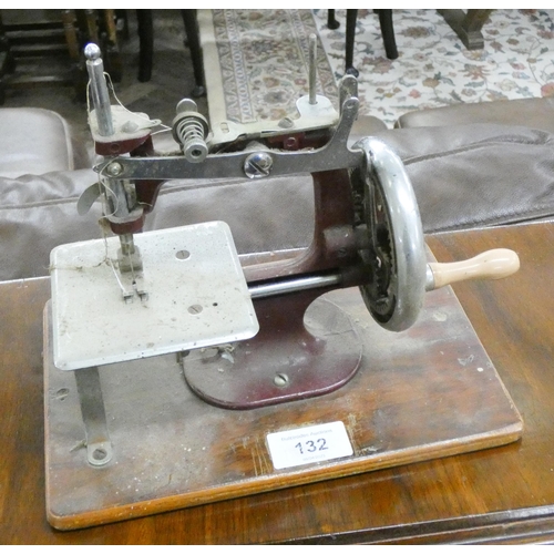 132 - A miniature sewing machine