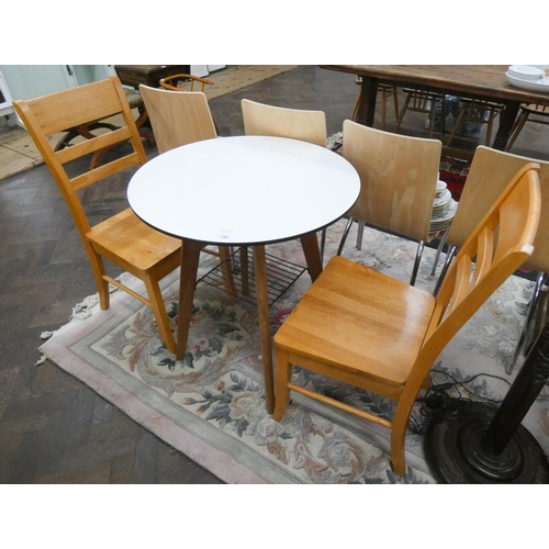 138 - A small white circular bistro table and a pair of modern beech dining chairs