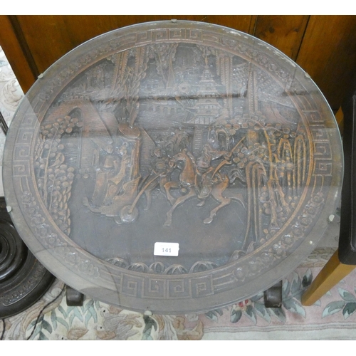 141 - A carved Chinese occasional table come fire screen with glass top, 2' diameter