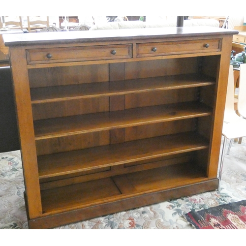 148 - A good quality low oak bookcase, fitted two drawers and open shelves, 56