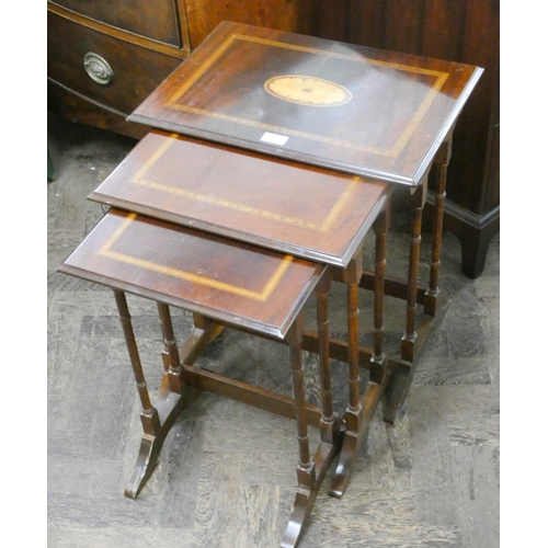 195 - A nest of three inlaid mahogany coffee tables with fine turned legs