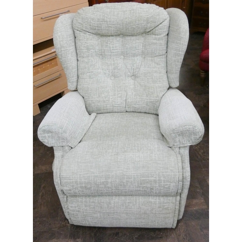 229 - A Sherbourne Rise and Recline easy chair in pale green patterned covering