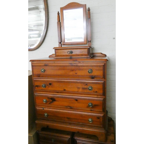 241 - A pine chest of four long drawers with free standing dressing table mirror