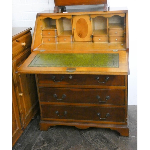 247 - A yew wood bureau with four long drawers under, 2'6 wide