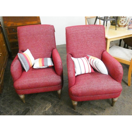 248 - A pair of mid-century red upholstered easy chairs with scatter cushions