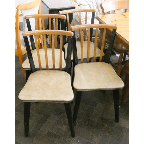 252 - A set of four 1960's retro slat back dining chairs with cream vinyl seats