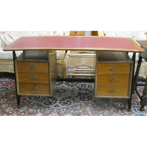 259 - A mid-century curved desk fitted six drawers with red leather top, on black tapering legs. 55