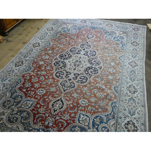 261 - A fawn and patterned Persian design wool pile rug, 11' x 6'9