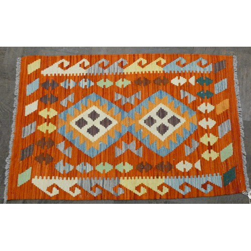 157 - Two small patterned Kilim style wool pile rugs, each approx 3' x 2'