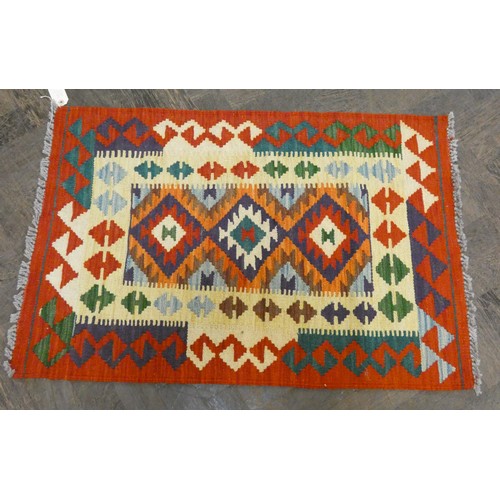 157 - Two small patterned Kilim style wool pile rugs, each approx 3' x 2'