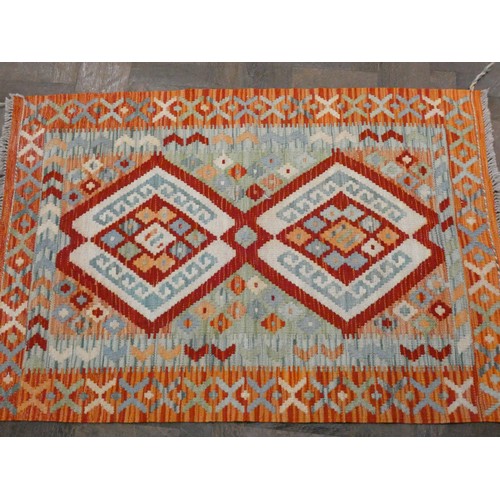 158 - An orange and patterned Kilim style wool pile rug, 4' x 2'10