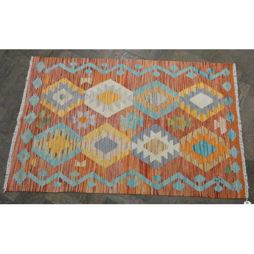 159 - An orange and patterned wool pile Kilim style rug, 4'3 x 2'8