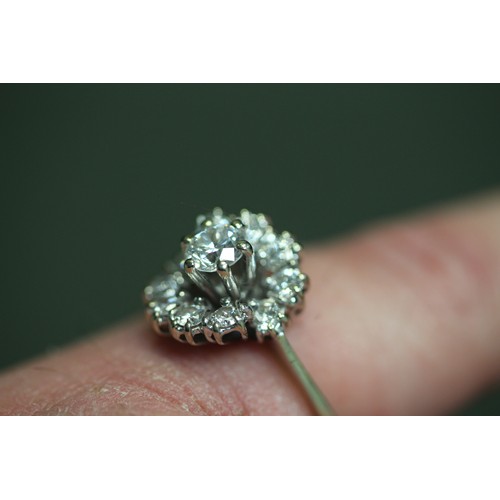 589 - Diamond cluster ring, mid-century setting in an off set design, unmarked white gold, ring size M