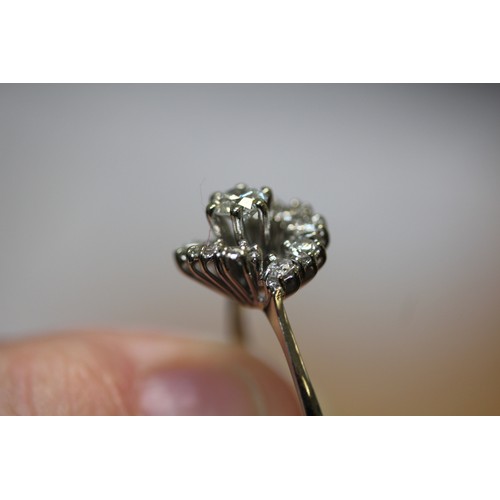 589 - Diamond cluster ring, mid-century setting in an off set design, unmarked white gold, ring size M