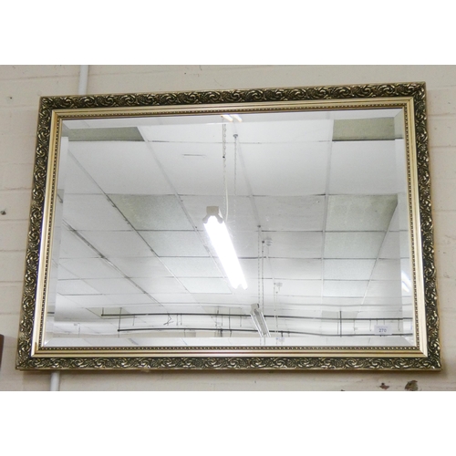 270 - A large bevelled wall mirror in decorative gilt frame