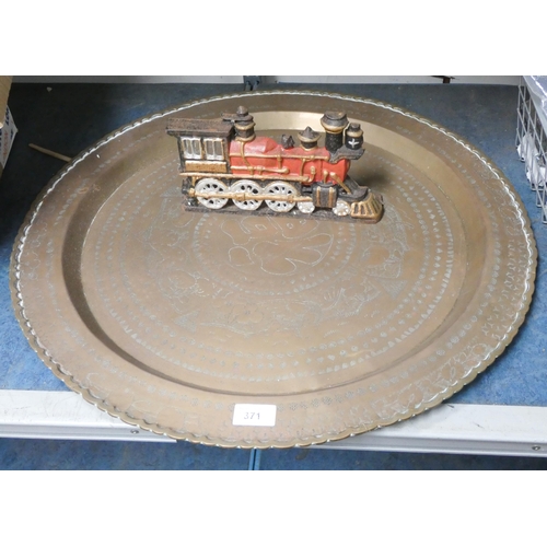 371 - A large brass tray and a heavy train shaped door stop