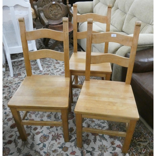 83 - Six heavy pine ladder back style dining chairs with panel seats