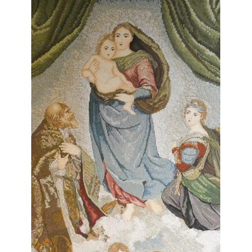 293 - A large petit point and gross point needlework tapestry picture depicting The Virgin and Child in a ... 