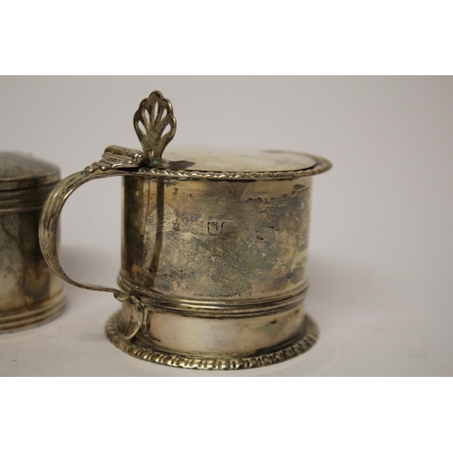 506 - Two hallmarked silver mustards, both with blue glass liners