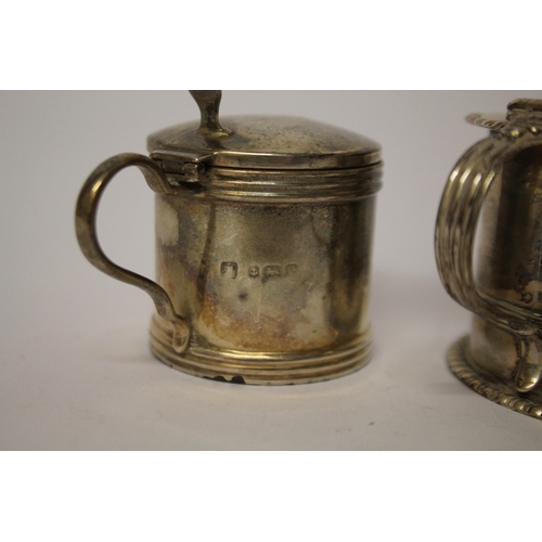 506 - Two hallmarked silver mustards, both with blue glass liners