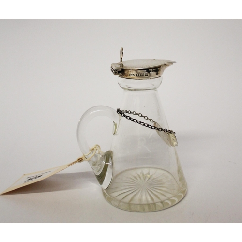 508 - A whisky tot with silver lid and silver decanter label