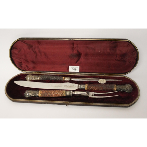 509 - A Victorian country house carving set, with antler handles, the steel blades stamped W Angus, 27 & 2... 