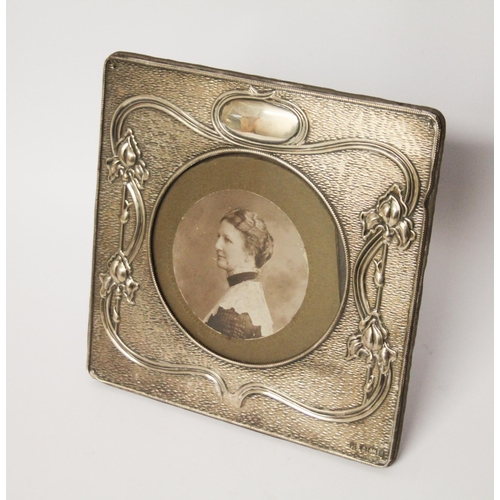 513 - Edwardian Art Nouveau silver photo frame, of square form, A J Zimmerman, Birmingham 1903. 15 cms squ... 